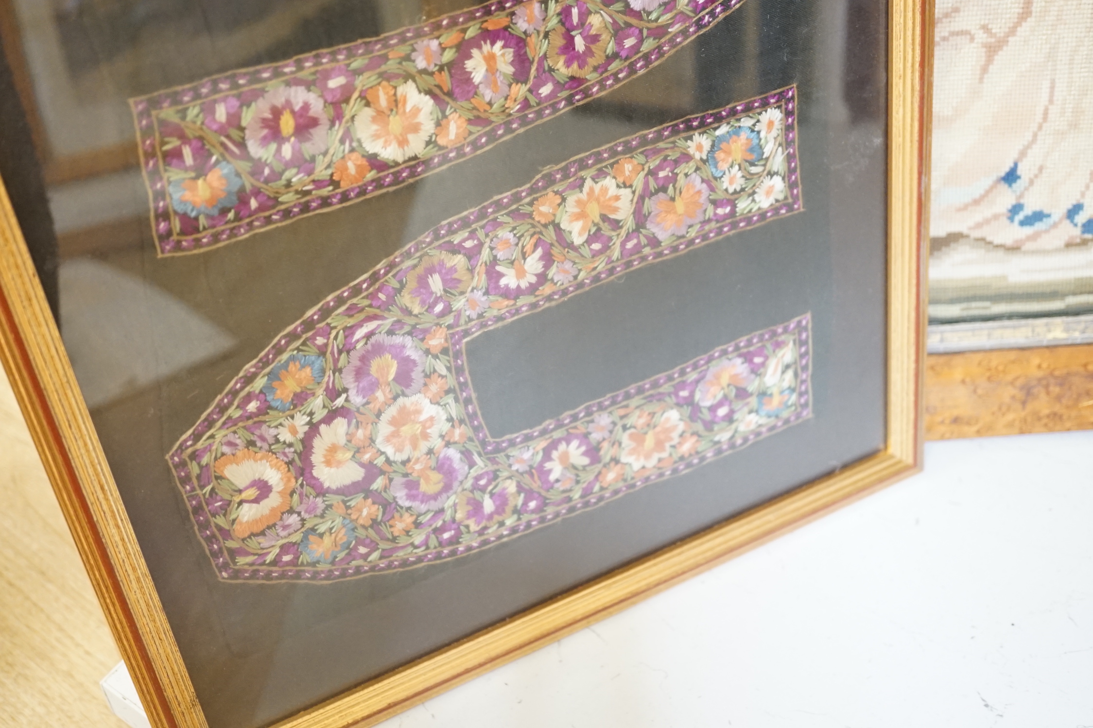 A framed Regency embroidery, two later figurative embroideries and a pair of embroidered slipper fronts, Regency embroidery 37cm wide, 41cm high